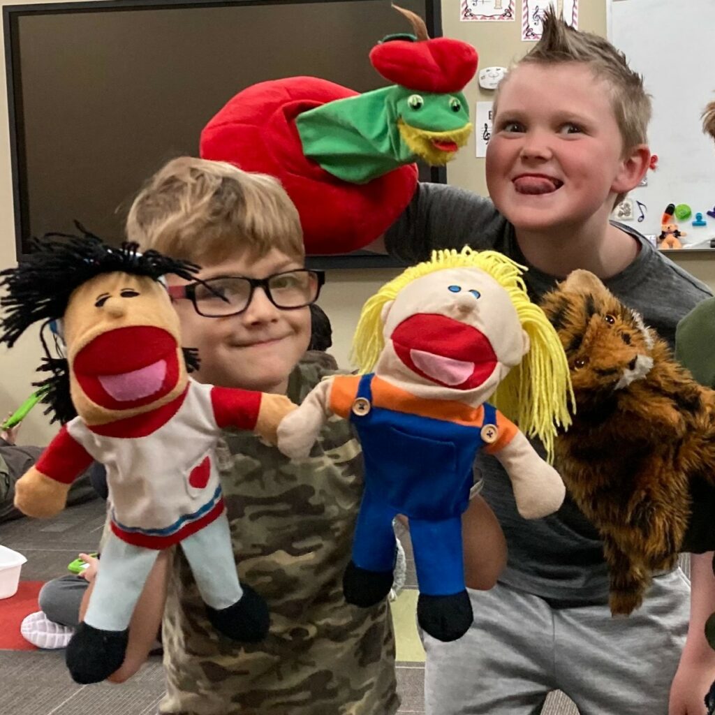 Sand Springs Education Foundation - Elementary Students having fun with Butler Puppets