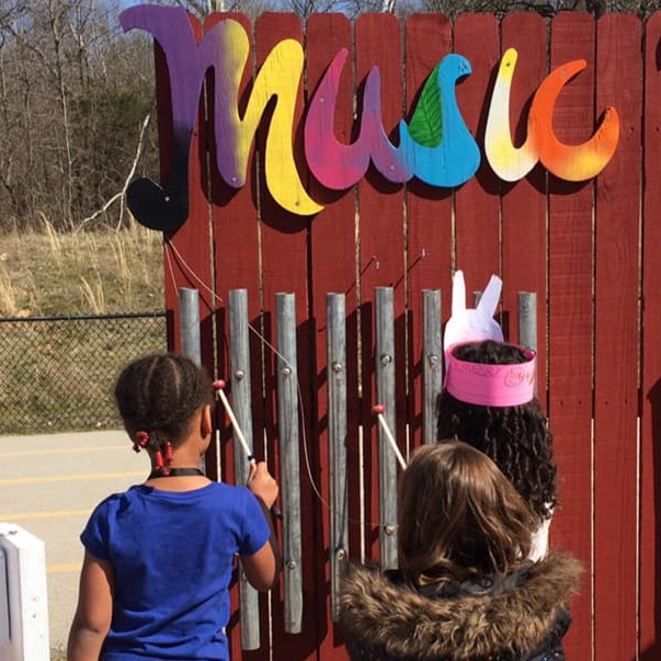 Sand Springs Education Foundation - Elementary Students playing chimes outdoors