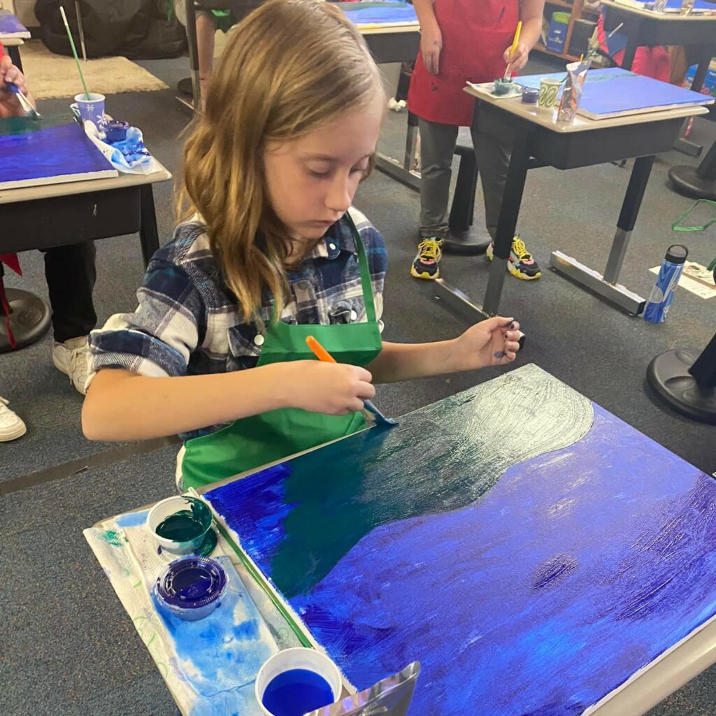 Sand Springs Education Foundation - Elementary Art Student Painting in Classroom