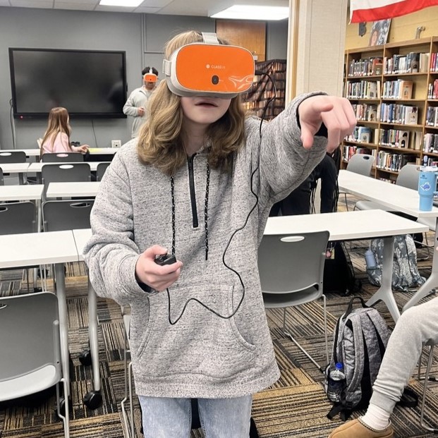 Sand Springs Education Foundation - High School Student using VR and pointing